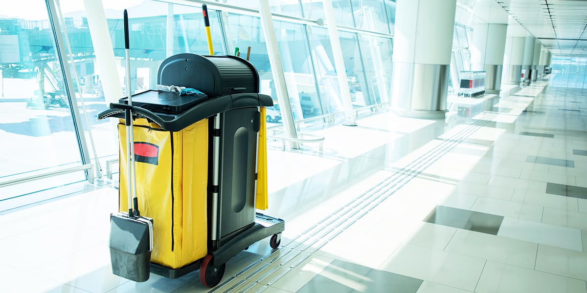 Cleaning tools cart used to clean a body fluid spill