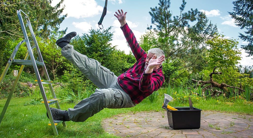 Old man falls from a ladder while in the garden