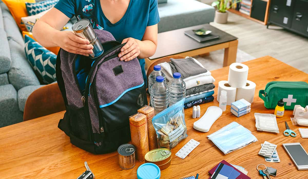 An image of someone packing an emergency go bag