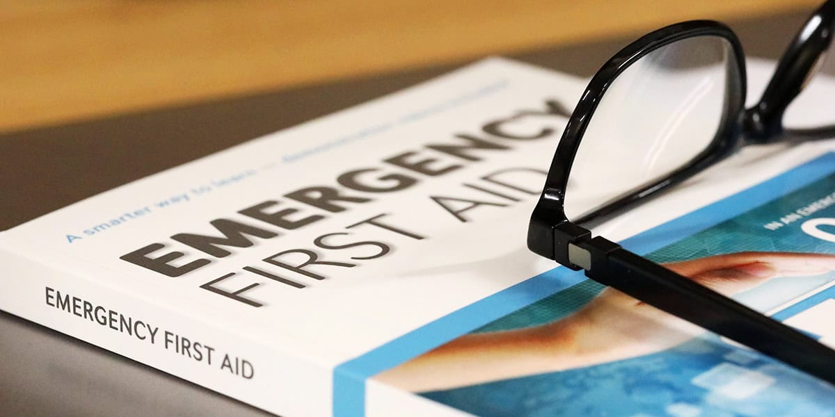 First aid manual on table