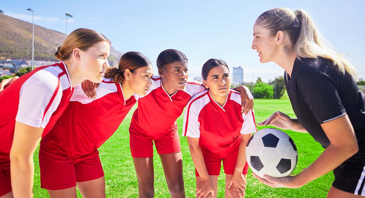 Coach preps her football team for the upcoming game