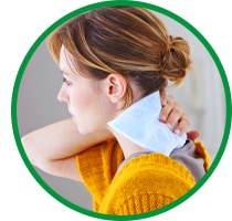 A woman applying an ice pack to her neck