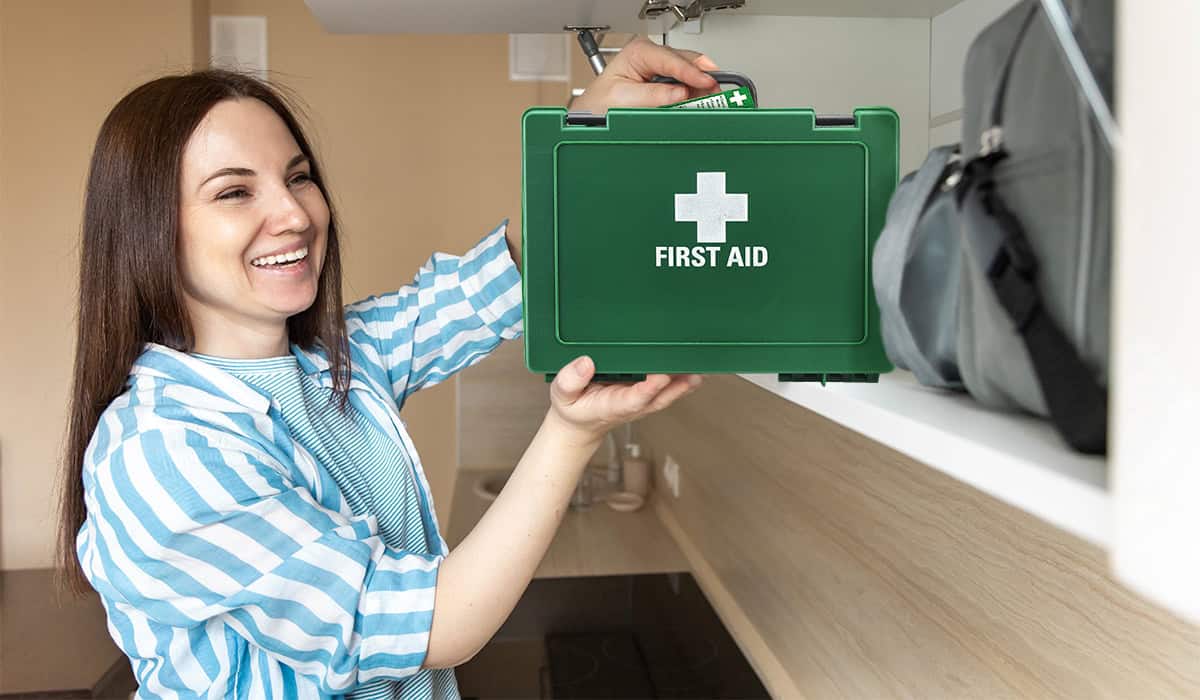 Putting away a first aid kit